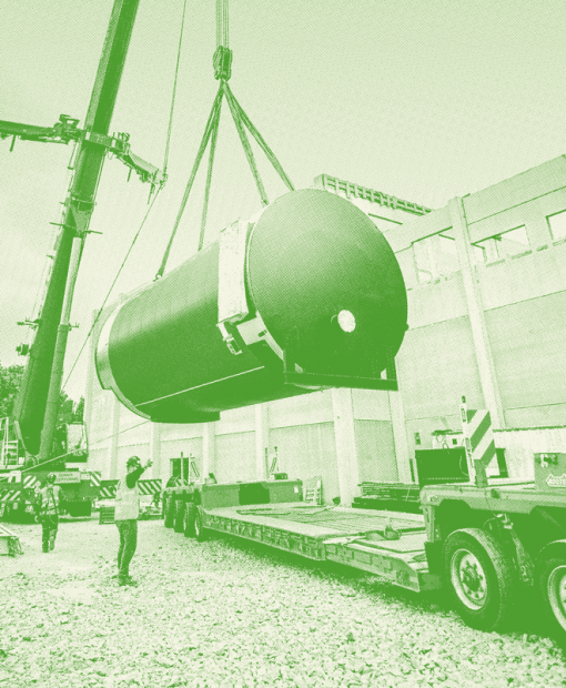 Machine lifting an energy storage system to represent Dalkia’s commitment to territories development