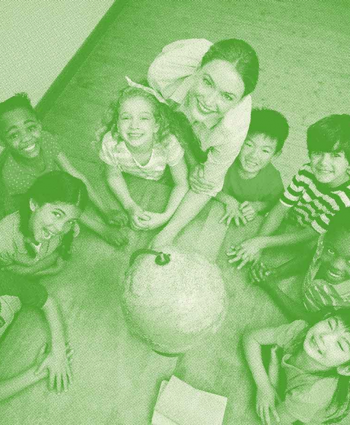 Group of children in front of a globe to represent Dalkia’s commitment for the preservation of natural resources 